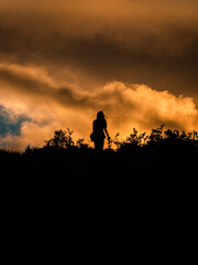 Fototapeta premium Woman shadow in a orange sunset
