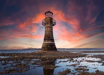 Wandcirkels aluminium This derelict iron lighthouse is situated on Whiteford Sands,  the Gower, Swansea. It is the last iron lighthouse in Europe. Sun setting at the end of a winter day. © postywood1