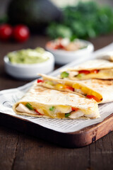 Typical Mexican quesadillas with chicken, pepper and cheese.