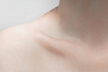 Collarbones. Close up portrait of beautiful albino female model. Parts of face and body. Beauty,...
