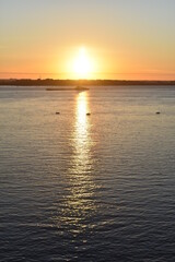 cargo ship sails at dawn on the Volga