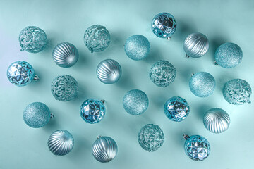 Christmas Festive Banner, Background. Monochrome Flat-lay with various blue Christmas Decoration Balls over light blue background, top view copy space, simple pattern