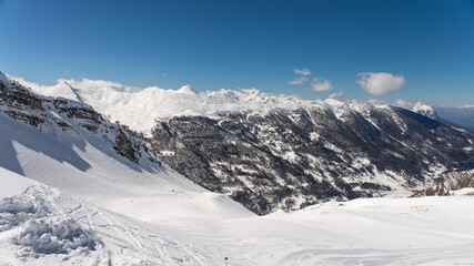 Fototapeta na wymiar Risoul resort, French alps in winter, snowy mountains in France
