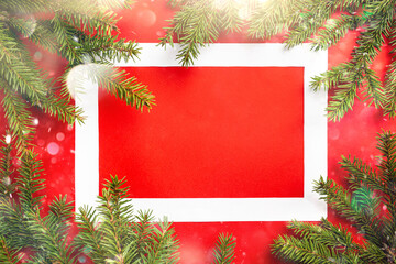 Fototapeta na wymiar Christmas holidays composition on red background with copy space and frame for your text