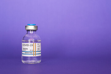 COVID-19 coronavirus vaccine isolated on purple background