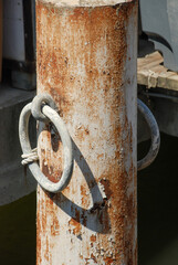 Rusty mooring pole in harbour Le Grau du Roi in south of France, Europe