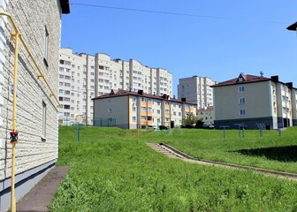 Courtyard with tall and small houses
