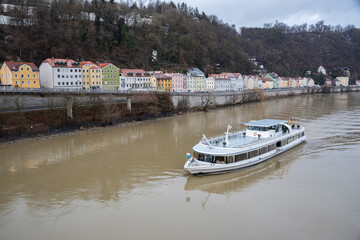Obraz premium a pleasure boat sails along the Danube to Passau
