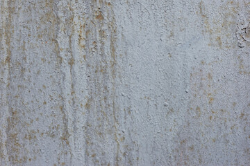 old rusty texture of cracked white paint The old cracked paint on a wall surface