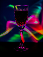 crystal goblet filled with wine on a bright background