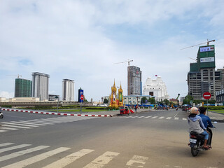 Scooter at a crossroad corner in phnom penh with construction at the background