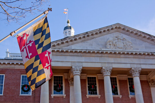 Close up view of Maryland state flag in front of the capitol state house in Annapolis, MD.