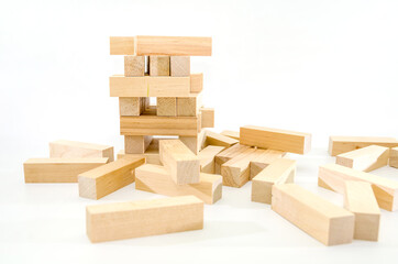 planning, risk and strategy in business. Felted tower with wooden blocks. Economy collapse, economic crisis concept.
