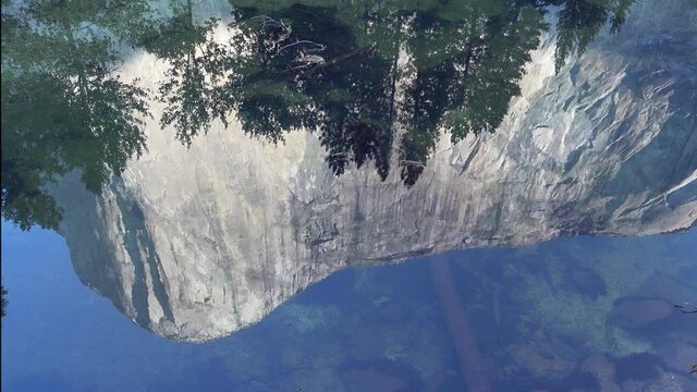 El Capitan, one of rock climbing&rsquo;s Great Walls, reflected in the quite autumn water of the Merced River, Yosemite Valley, CA.