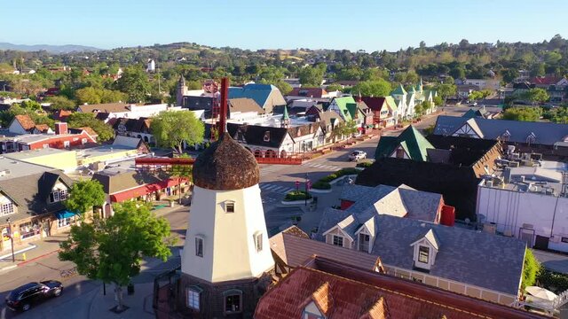 Aerial over the quaint Danish town of Solvang, California with Denmark windmill and shops.