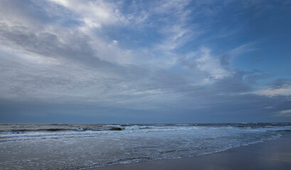 Fototapeta na wymiar Sea, waves and beach. North sea coast. Julianadorp. Netherlands.