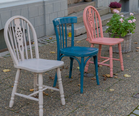 Fototapeta na wymiar colored chairs in a pedestrian area