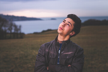 Young man posing at the park.