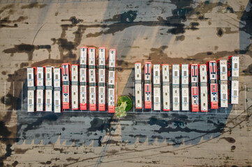 Aerial view of a bus park with many electricity and gasoline powered buses