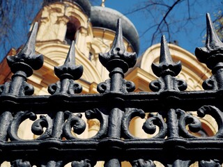 Fragment of a black metal fence of an Orthodox church