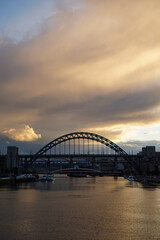 Stunning sunset over the Tyne bridge in Newcastle upon Tyne with dramatic clouds overhead