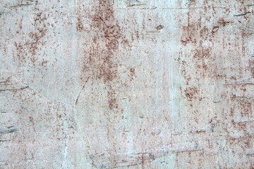 Retro concrete weathered wall old texture with rust leaks, with white, brown, gray and beige spots.. Design template. An old crumbling plaster. The background for text and design.