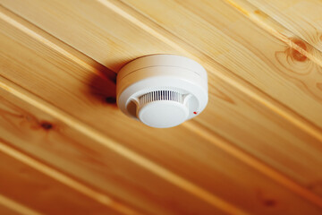 smoke detector of fire alarm in wooden house