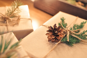 gifts in craft paper on wooden background