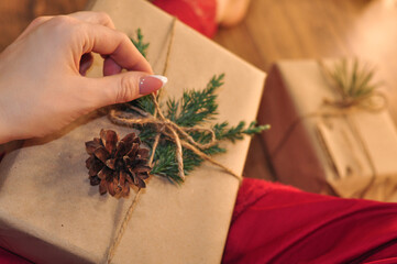 gifts in craft paper on wooden background