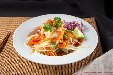 A view of a plate of green papaya salad.