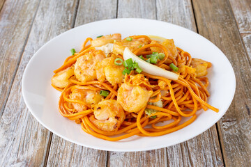 A view of a plate of shrimp chow mein.