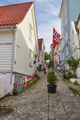 old center of bergen, wooden sailors houses, national holiday flag day, decorated city, celebration, colorful houses - 389967826