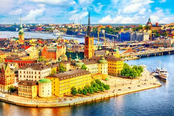 Fototapeta na wymiar Beautiful aerial view of Stockholm Old town Gamla Stan from the City Hall Stadshuset. Beautiful summer sunny day in Stockholm, Sweden.