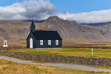 death, black church standing alone in icelandic landscape, icelandic autumn in beautiful weather, famous places without tourists, covid affects tourism - 389968613