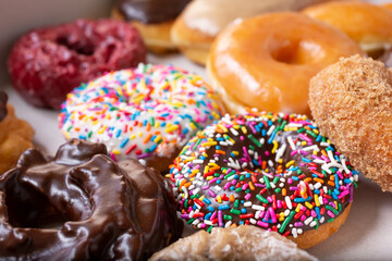 A closeup view of several popular donut flavors.