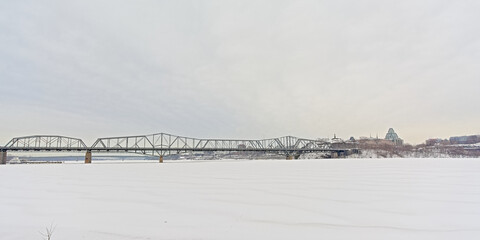 Alexandra bridge over frozen Ottawa river in winter. Canada