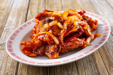 A view of a plate of Peking pork chops.