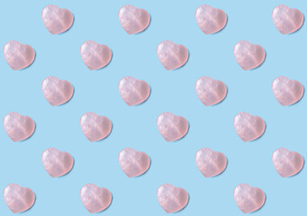 Rose quarts crystal hearts wallpaper background. Pink 3D hearts on light blue background.