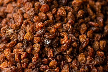 Close up of appetizing light brown raisins