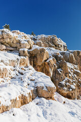Fototapeta na wymiar Beautiful rock mountains covered with snow in winter in Uzbekistan in the area of Beldersay resort