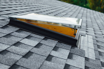 open roof window on shingles flat polymeric roof-tiles