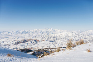 Panoramic view of the mountains with rocks in the Tien Shan mountains in Central Asia near Tashkent on a Sunny winter day. The best view from the Beldersay cable-way