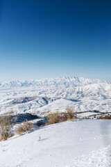 Fototapeta na wymiar An incredibly beautiful panorama of the winter mountains of the Tien Shan in Uzbekistan