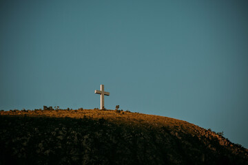Tall cross statue on top of a hill in Mostar, Bosnia and Herzegovina