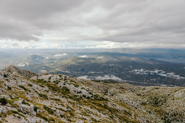 Fototapeta na wymiar Mountain Biokovo. Mountain landscape with low clouds. Croatia