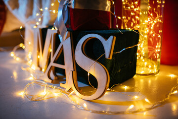 New Year 2021 interior with candles, bulbs and bokeh. Room decorated to christmas celebration....