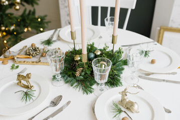 Table served for Christmas dinner in living room