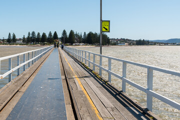 Horse drawn tramway on the causeway bridge from Victor Harbor to Granite Island, South Australia