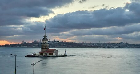 Beautiful cloudy sunset / evening at Bosphorus, Istanbul, Turkey. Timelapse clip with Maiden Tower, boats and landmarks of Istanbul 
