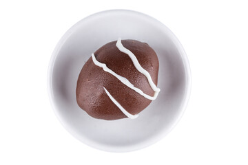 Chocolate truffle with green grape filling isolated on white background. Closeup photography.